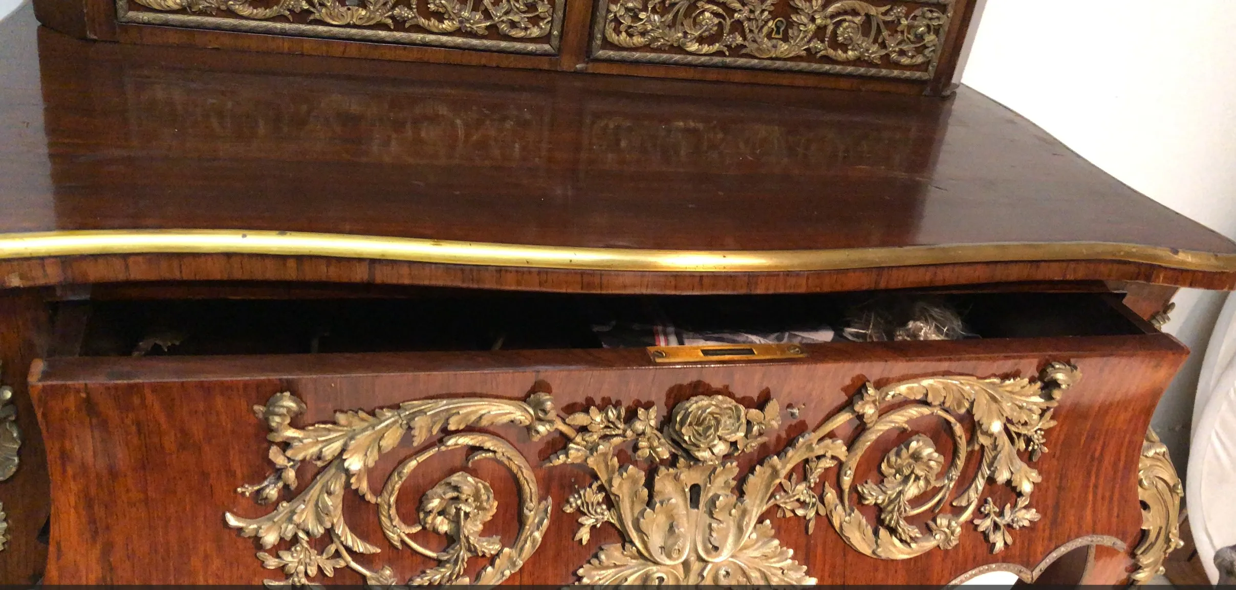 antique desk with golden details and polished wood