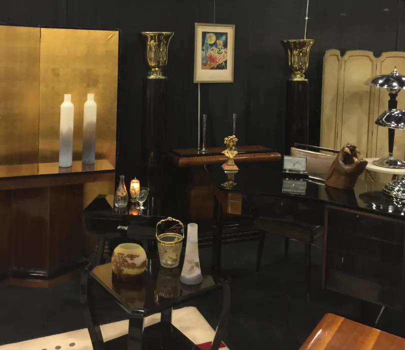 Antique desk showcasing elegant decorations and various accessories.