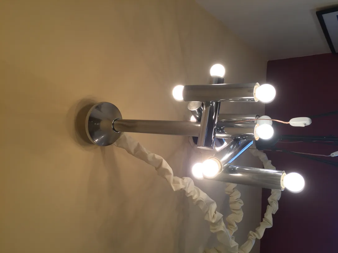 Antique hanging lamp featuring multiple protruding lights.