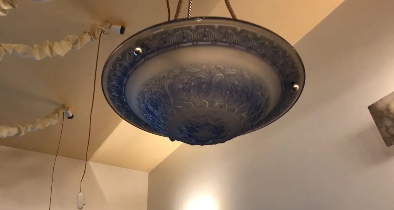 Antique hanging lamp with decorative design inside