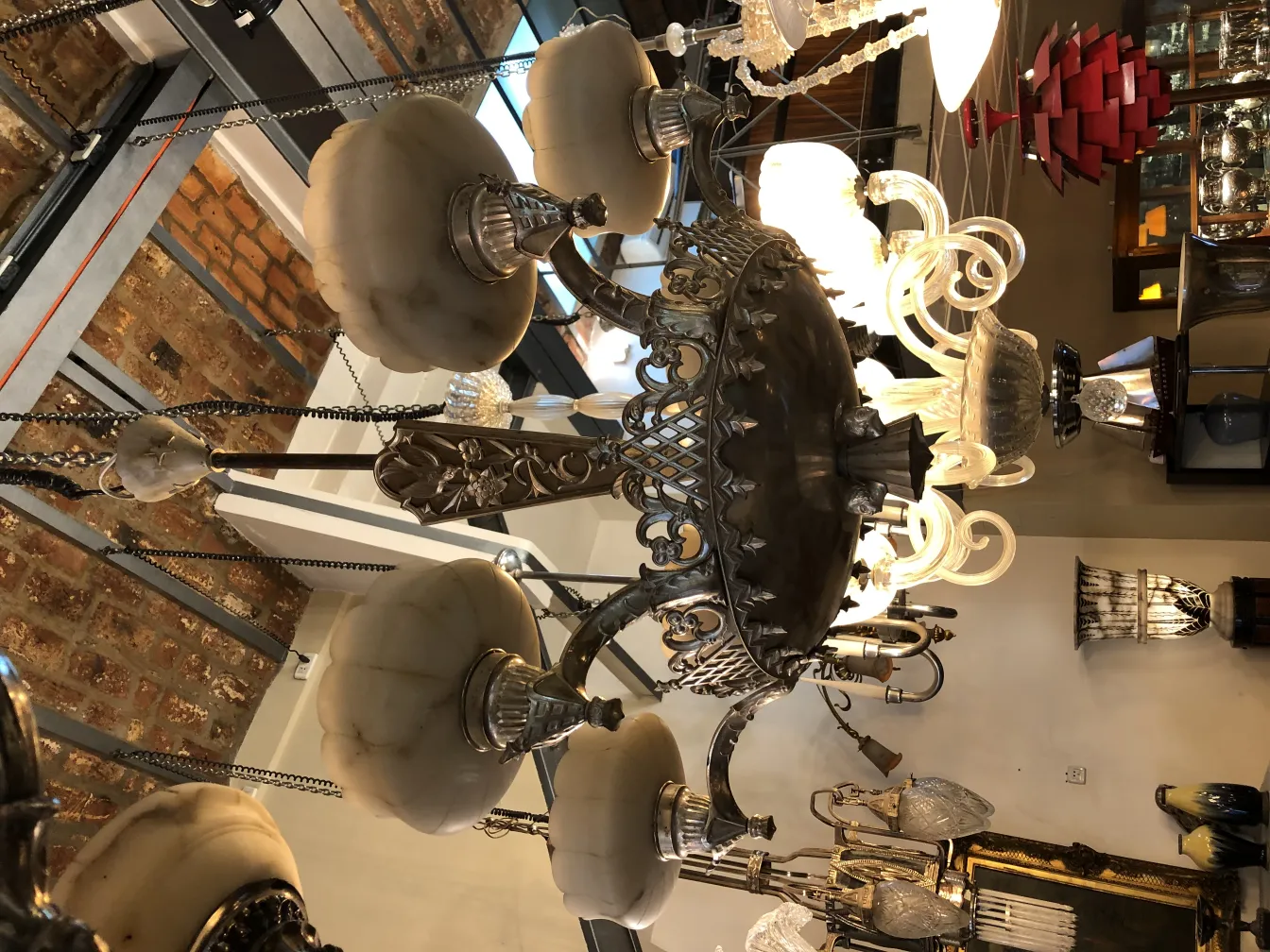 Antique hanging lamp featuring decorative details and crystals