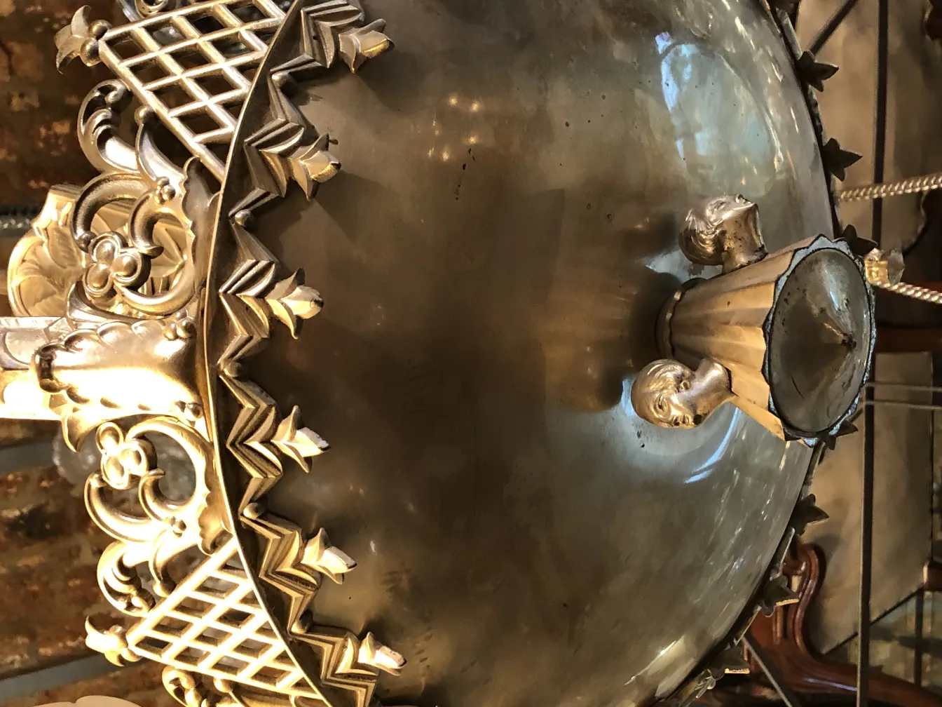 Antique hanging lamp featuring an ornate decorative design.