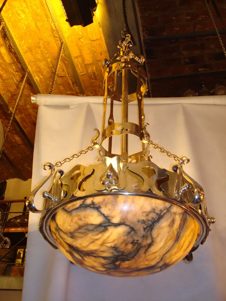 Antique hanging lamp with a sophisticated design and warm light.