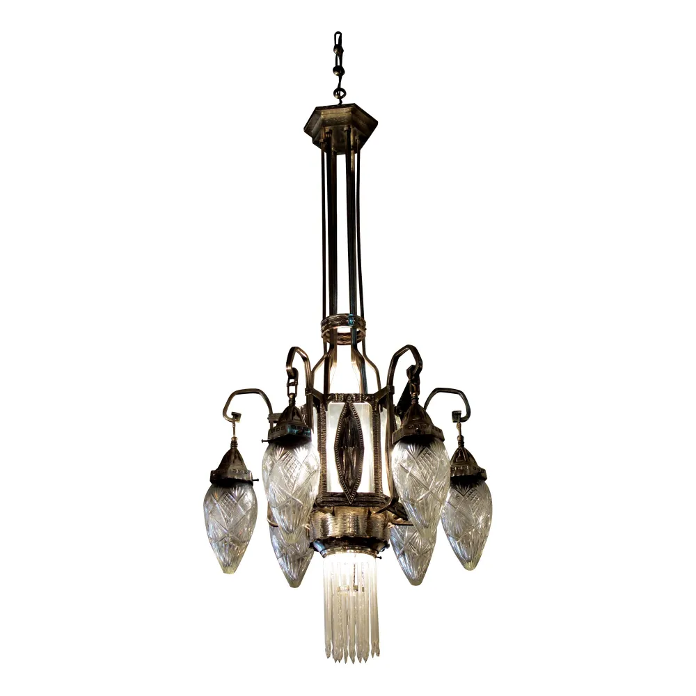 Antique hanging lamp with intricate crystal details, elegantly styled in a bright setting.