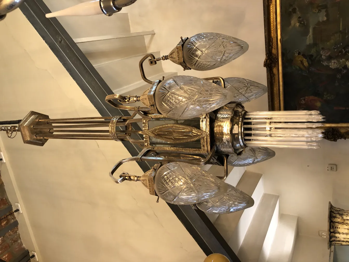 Antique hanging lamp showcasing intricate designs and hanging bulbs.