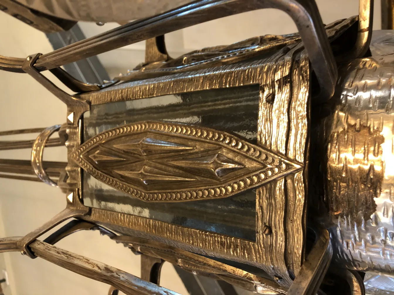 Antique hanging lamp with ornate design, enhancing the decor.