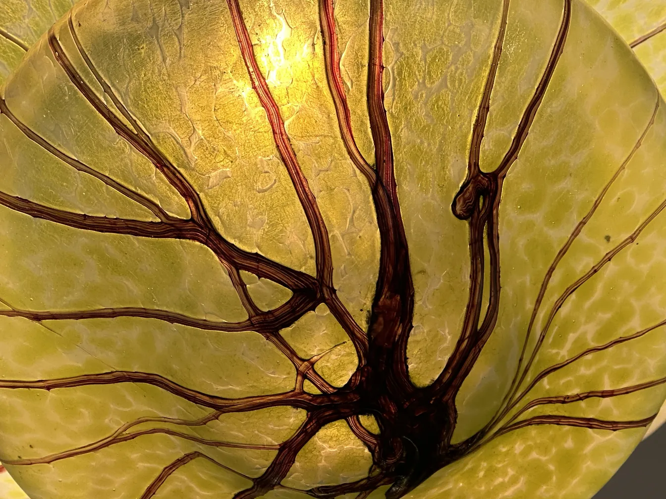 antique hanging lamp with organic design in yellowish color