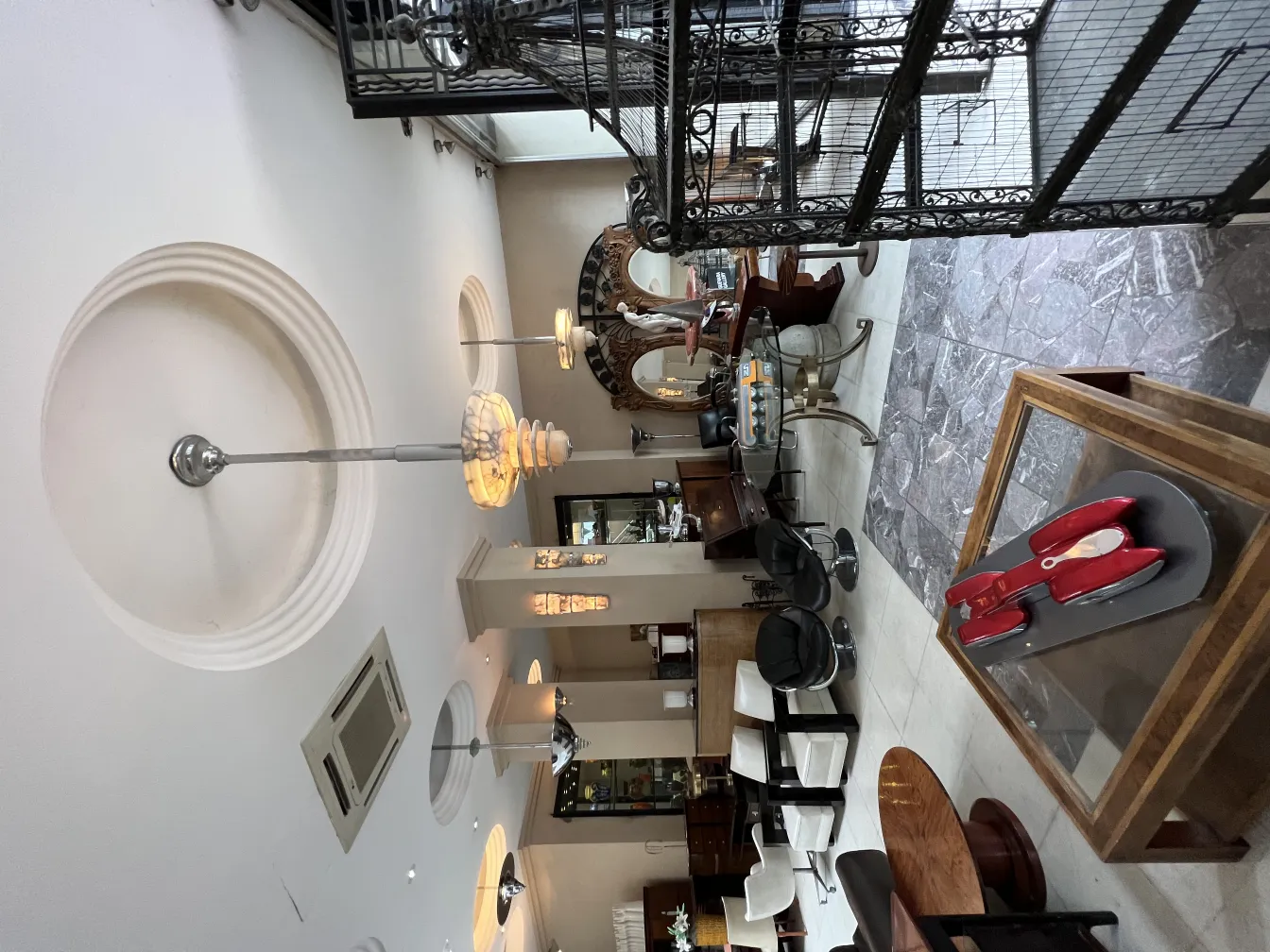 Antique hanging lamp with elegant design in a bright environment with various furniture