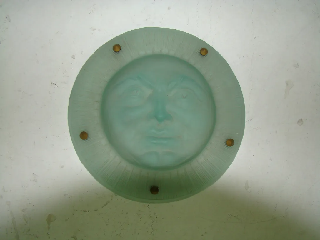 Antique hanging lamp st louis featuring a face design