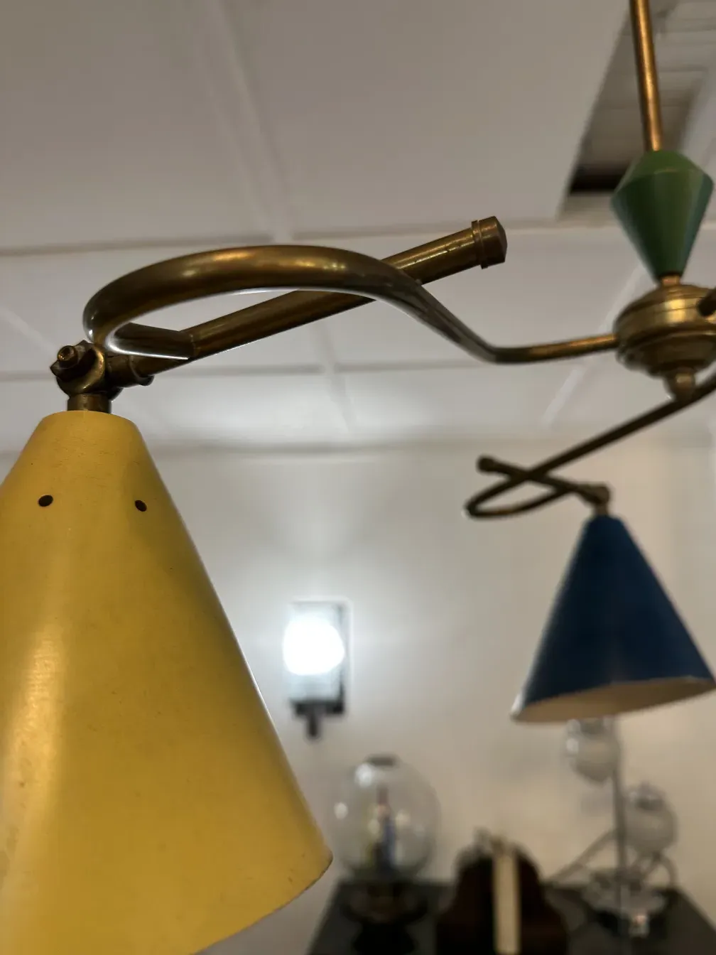 Antique hanging lamp with yellow and blue cones, retro atmosphere