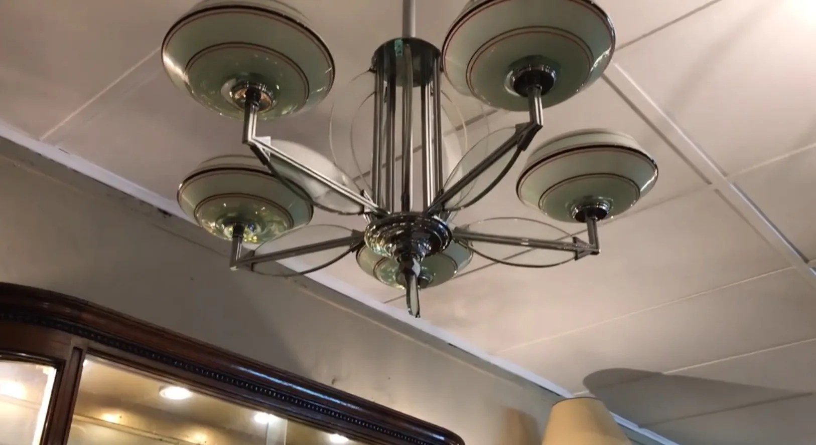 Antique hanging lamp with glass bases in an elegant setting.