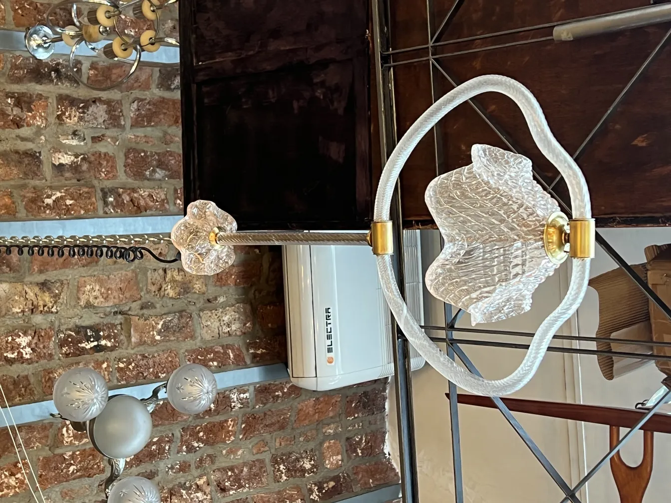 Antique hanging lamp with glass design and rustic setting