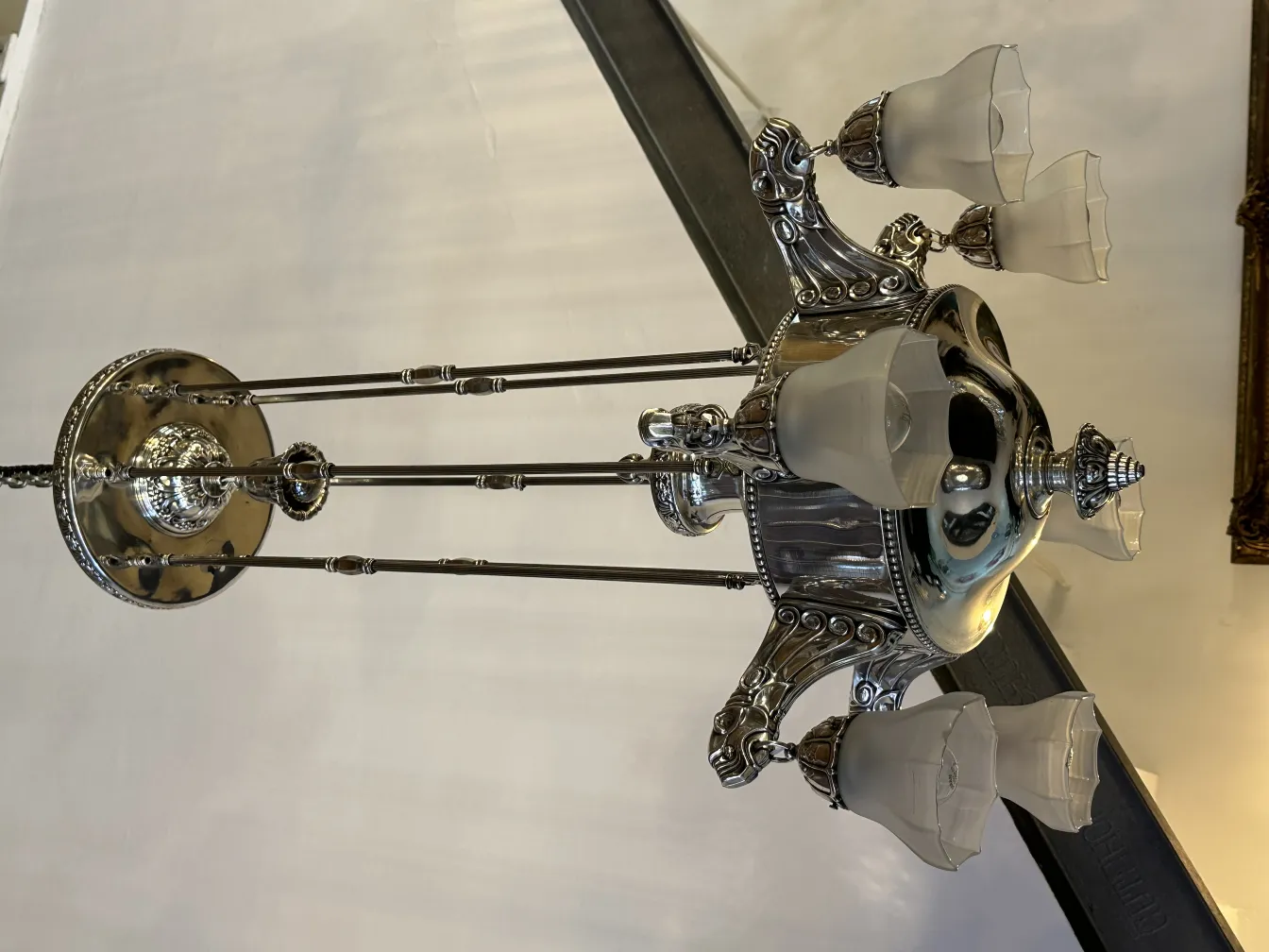 Antique hanging lamp with elegant glass lights, classic ambiance.