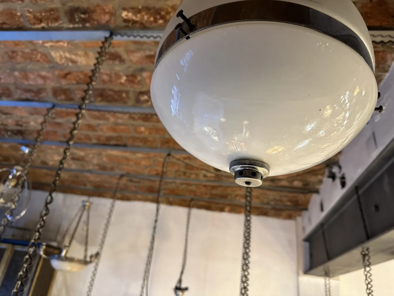 antique hanging lamp with metal details hanging from chains