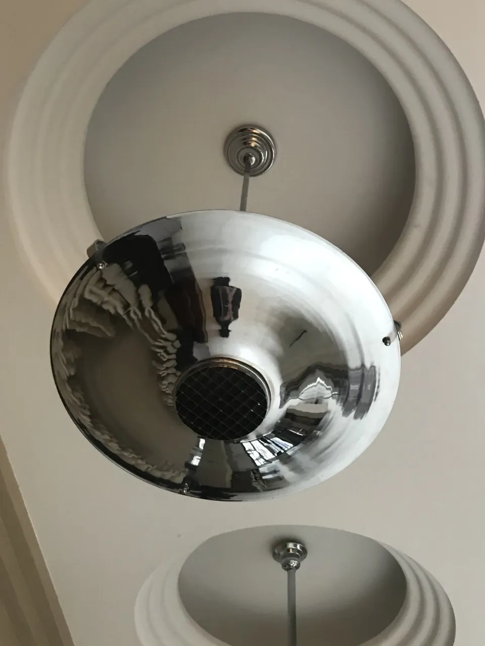 Antique hanging lamp with shiny finish in a room