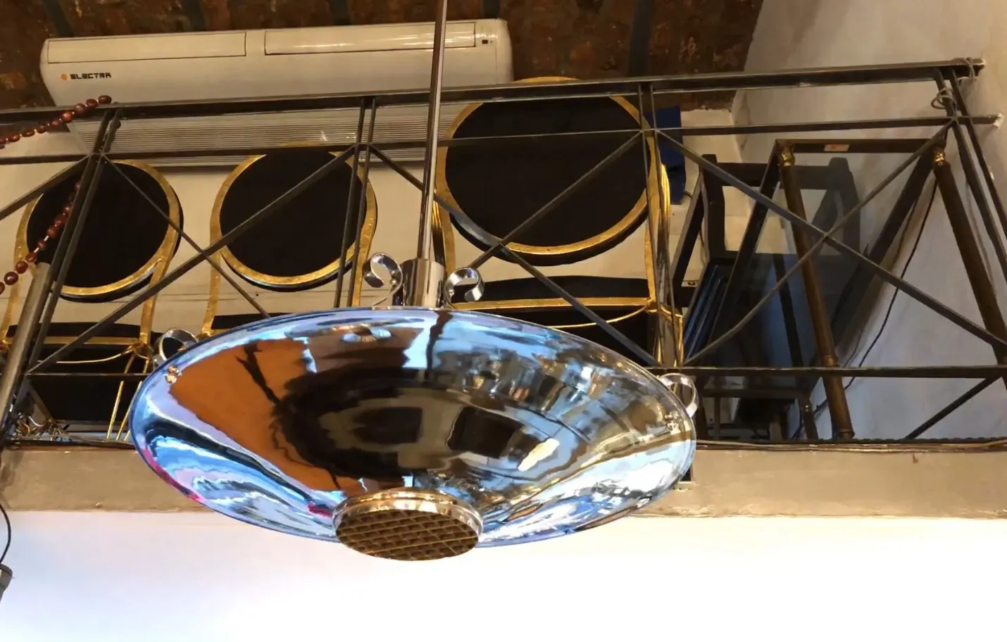 Antique shiny hanging lamp in stylish surroundings.