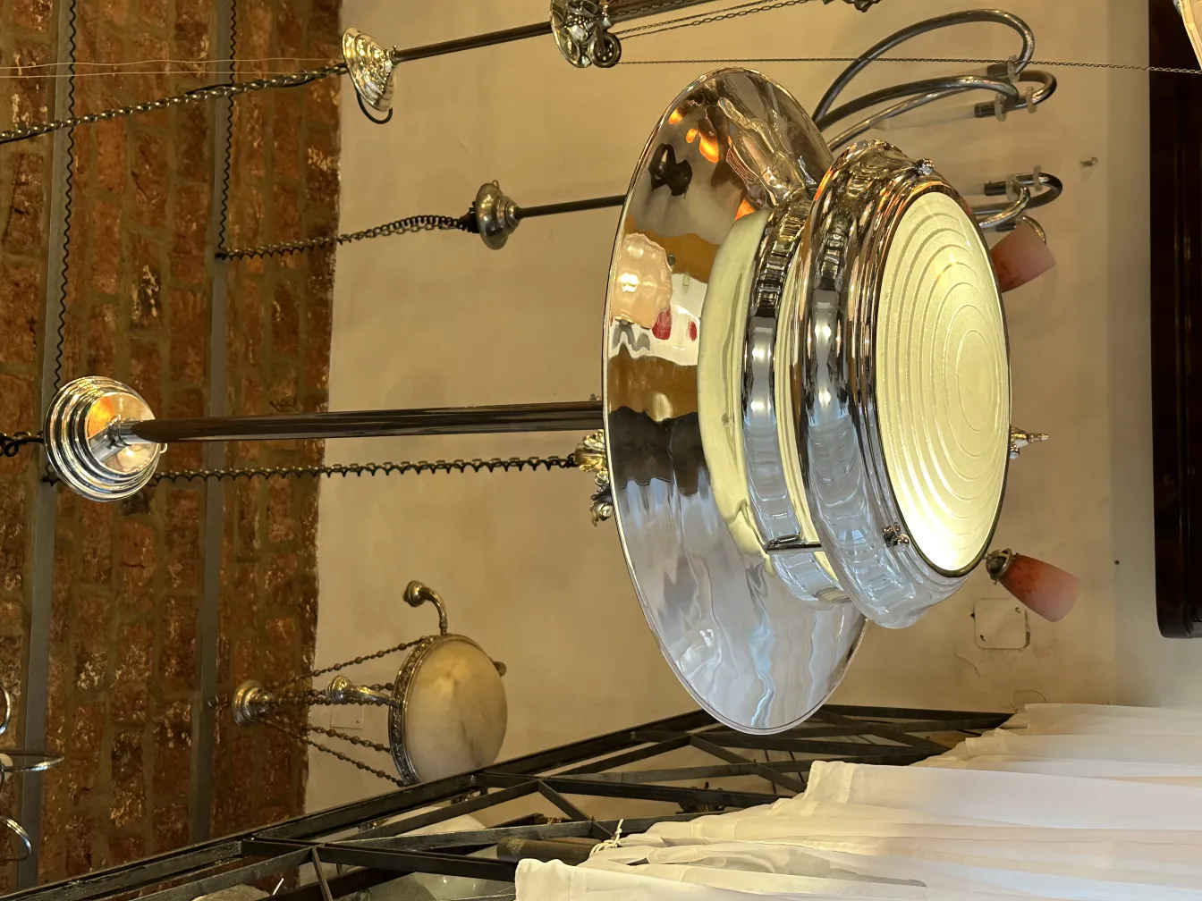 Antique hanging lamp with bright illumination in a cozy setting.