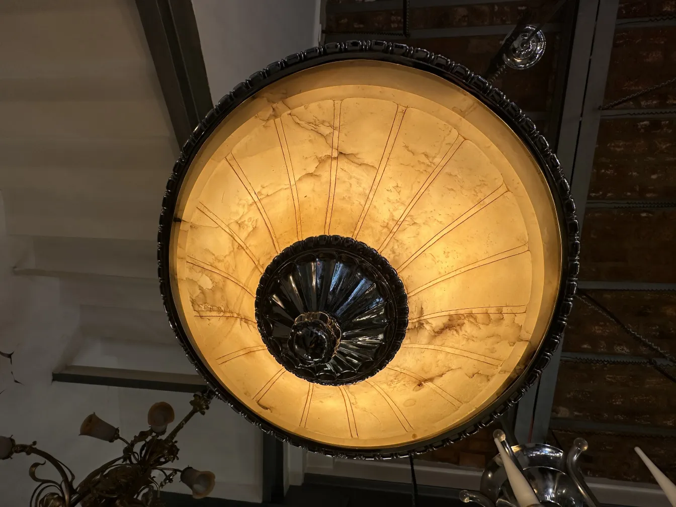 Antique hanging lamp with unique design in an elegant setting.