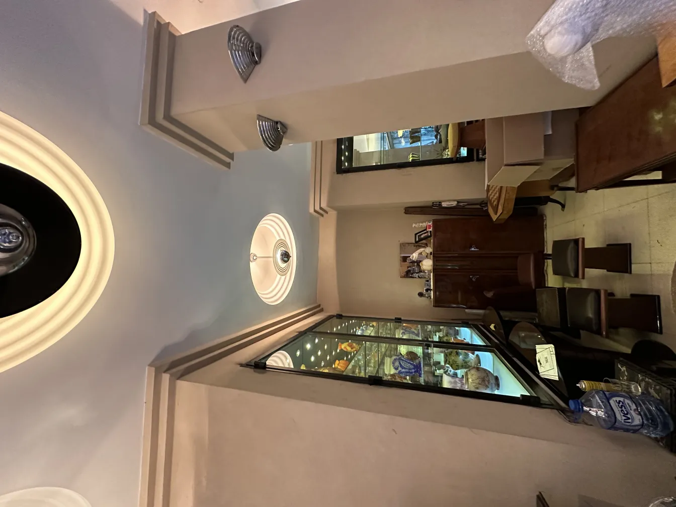 Antique hanging lamp in a cozy setting with wooden details.