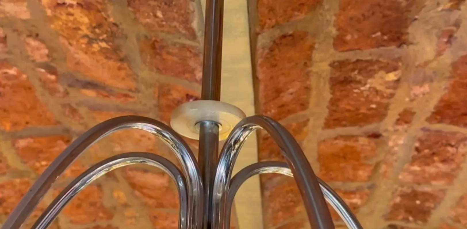 Antique hanging lamp featuring a glossy and stylish design.