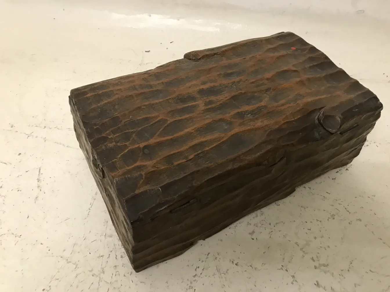 Antique wooden box with rustic texture and natural details.
