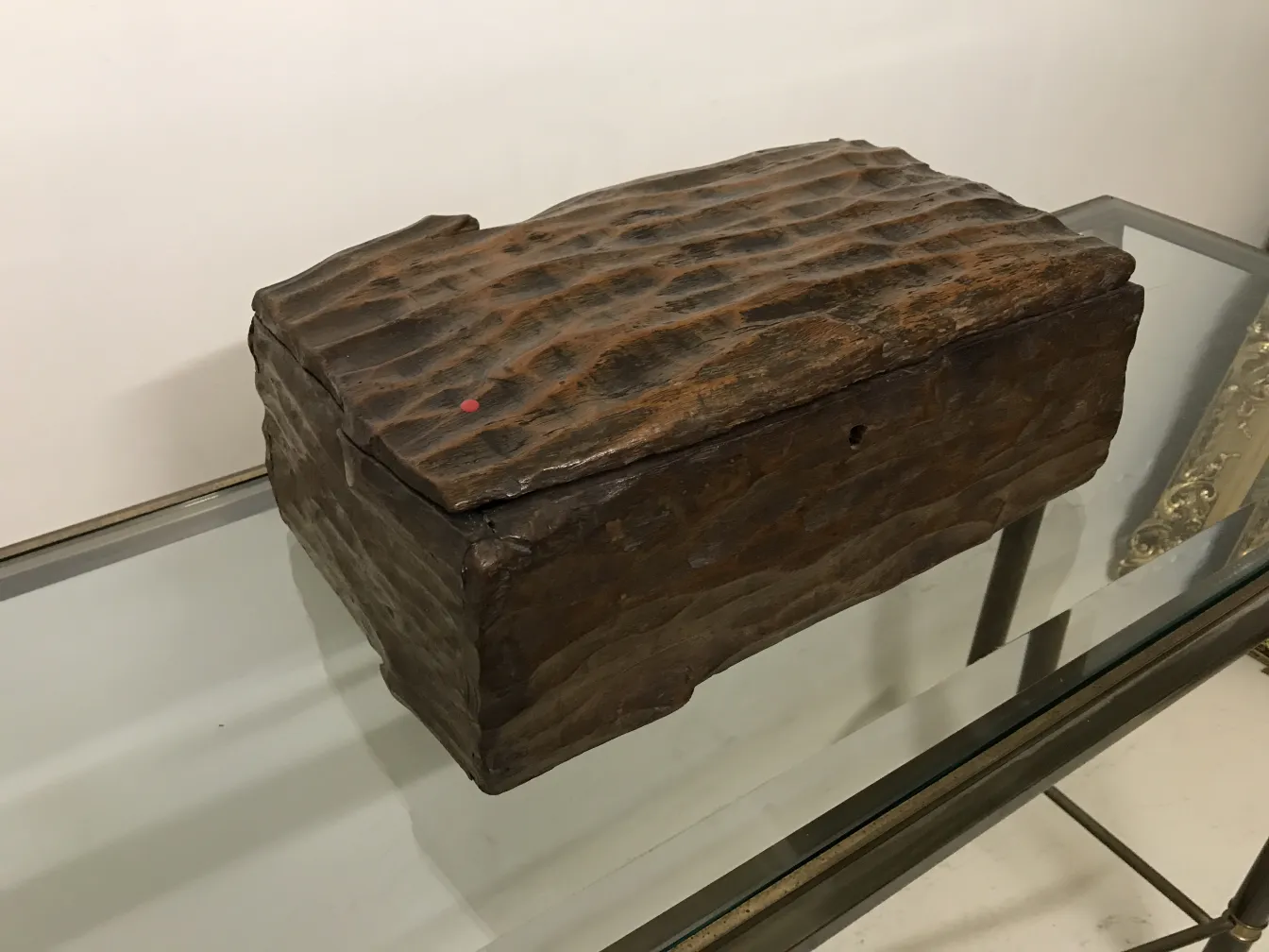 Antique wooden box with a rough texture, elegant setting.