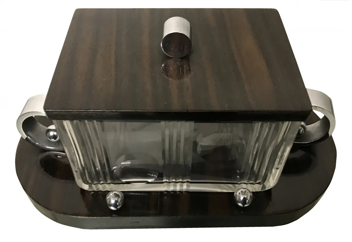 decorative antique box featuring a glass lid and silver details