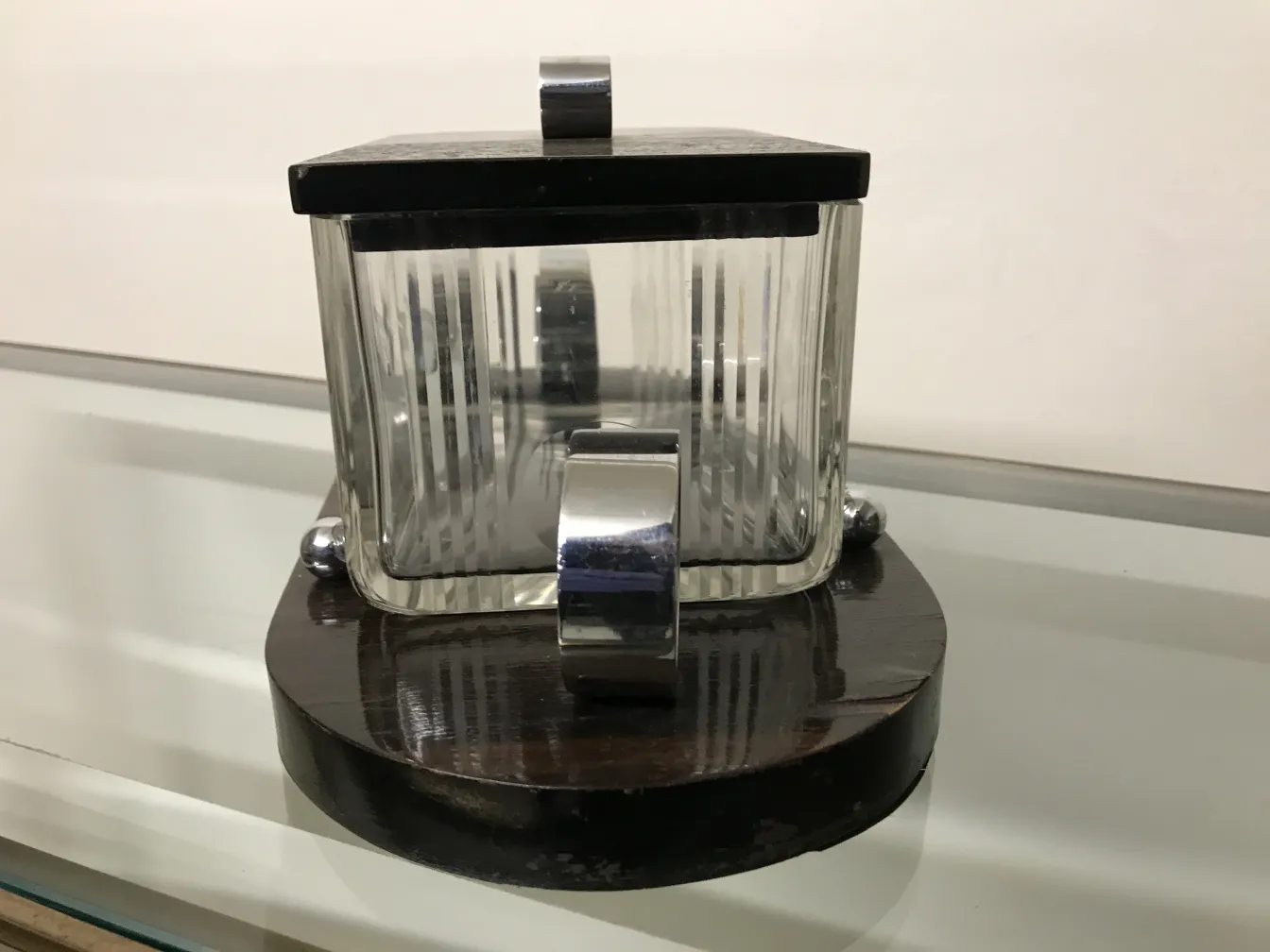 Antique box with glass lid and wooden base