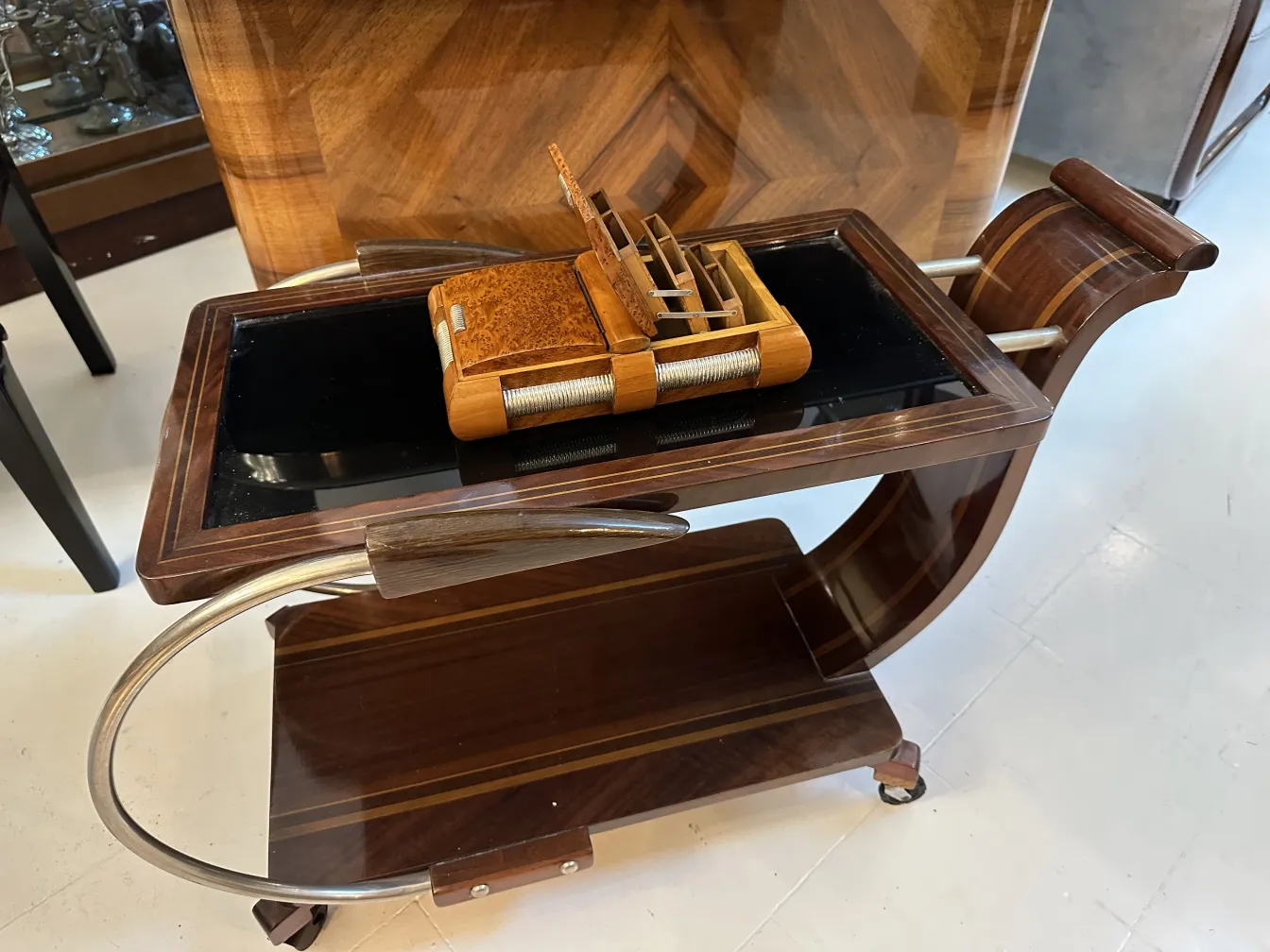 Antique box on a trolley with a sleek finish.