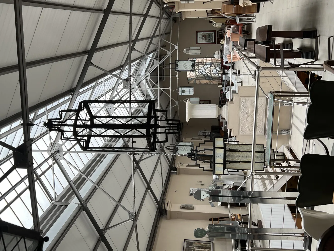 Two antique lanterns hanging in an elegant space.