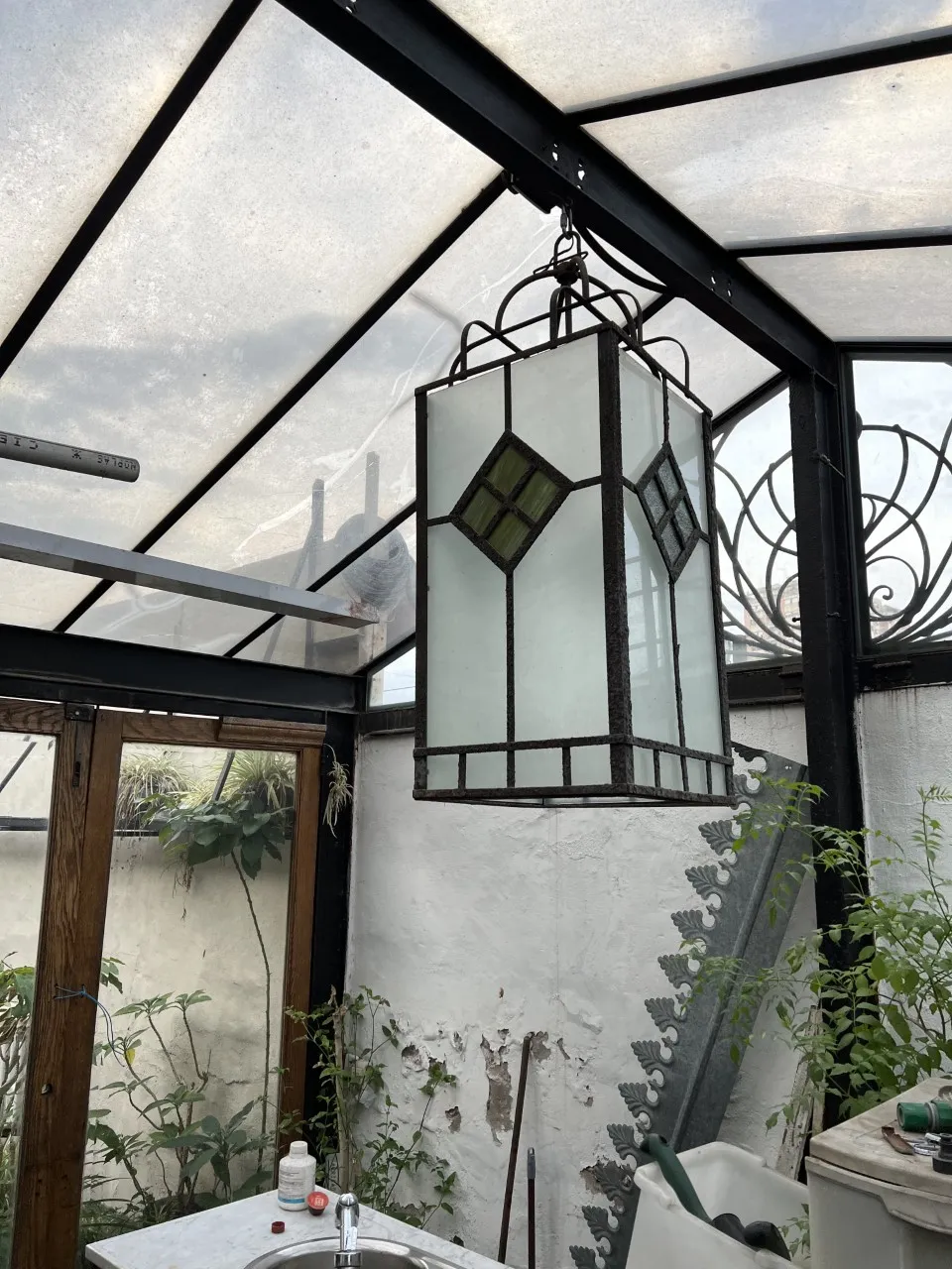 antique glass lanterns hanging in a natural space