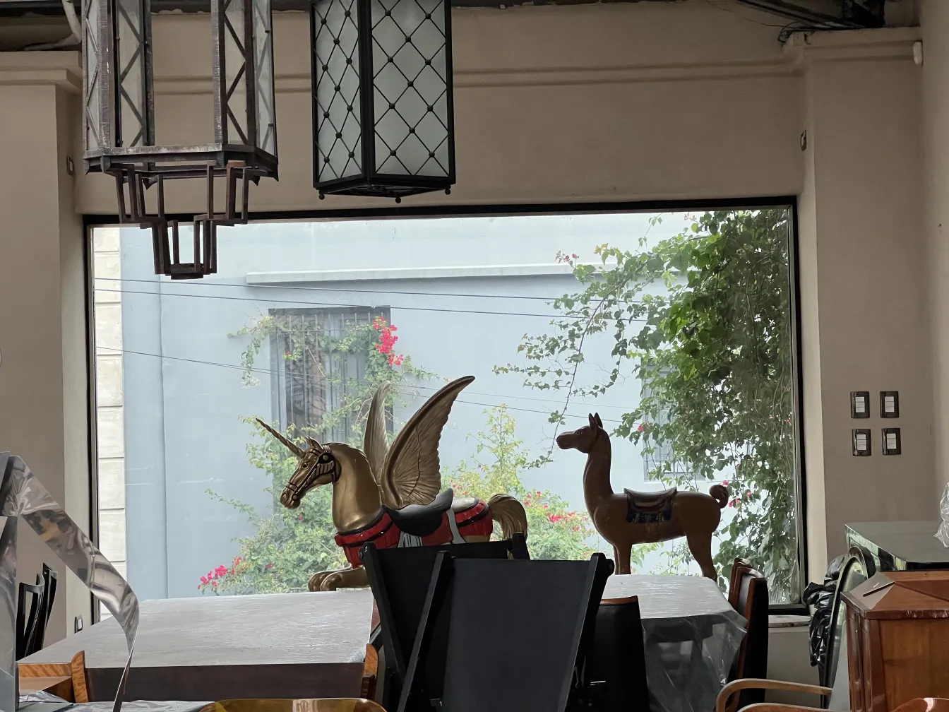 Two hanging antique lanterns with intricate design