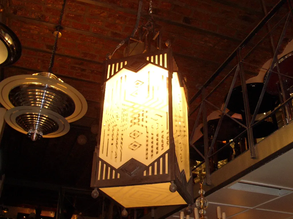 Two antique lanterns with soft light in a cozy setting