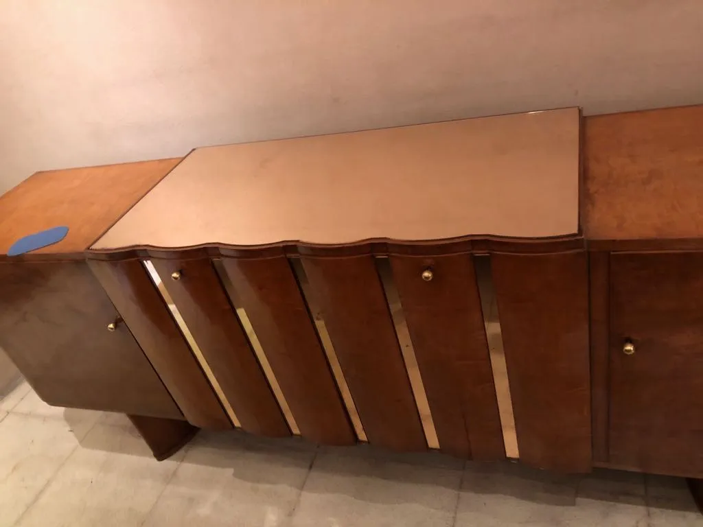 antique sideboard with gold accents and elegant design, warm atmosphere