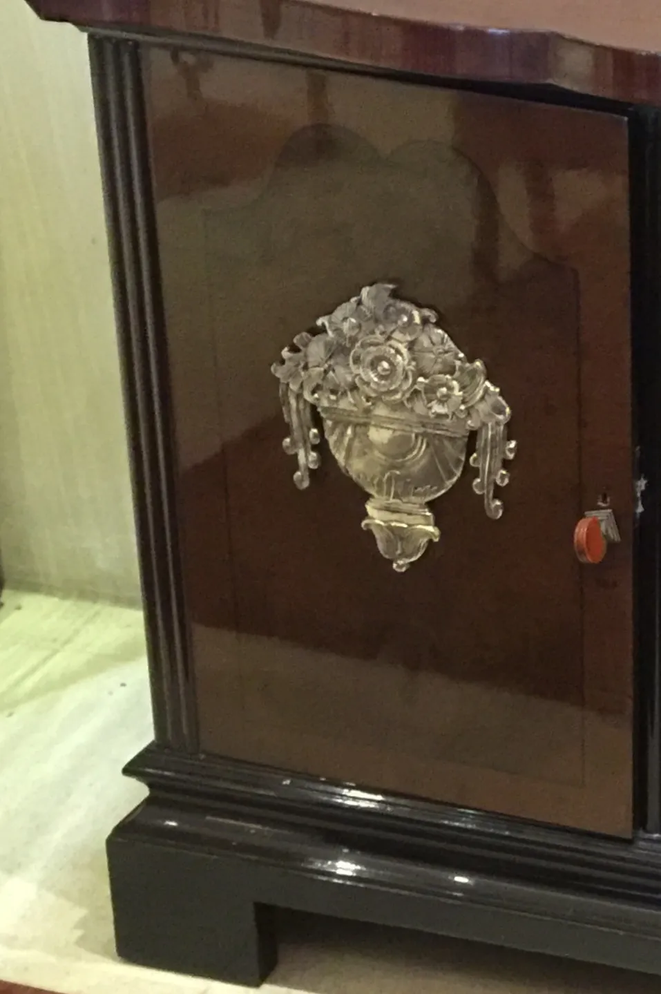 antique sideboard with decorative details on the door