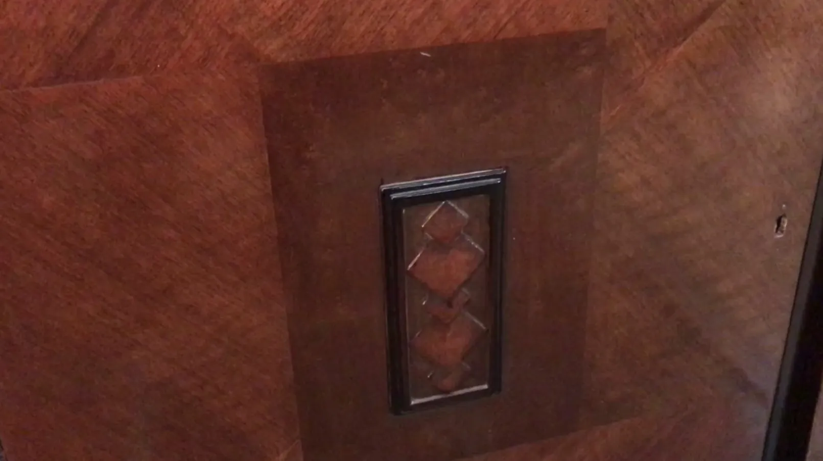 Antique sideboard featuring ornate door details.