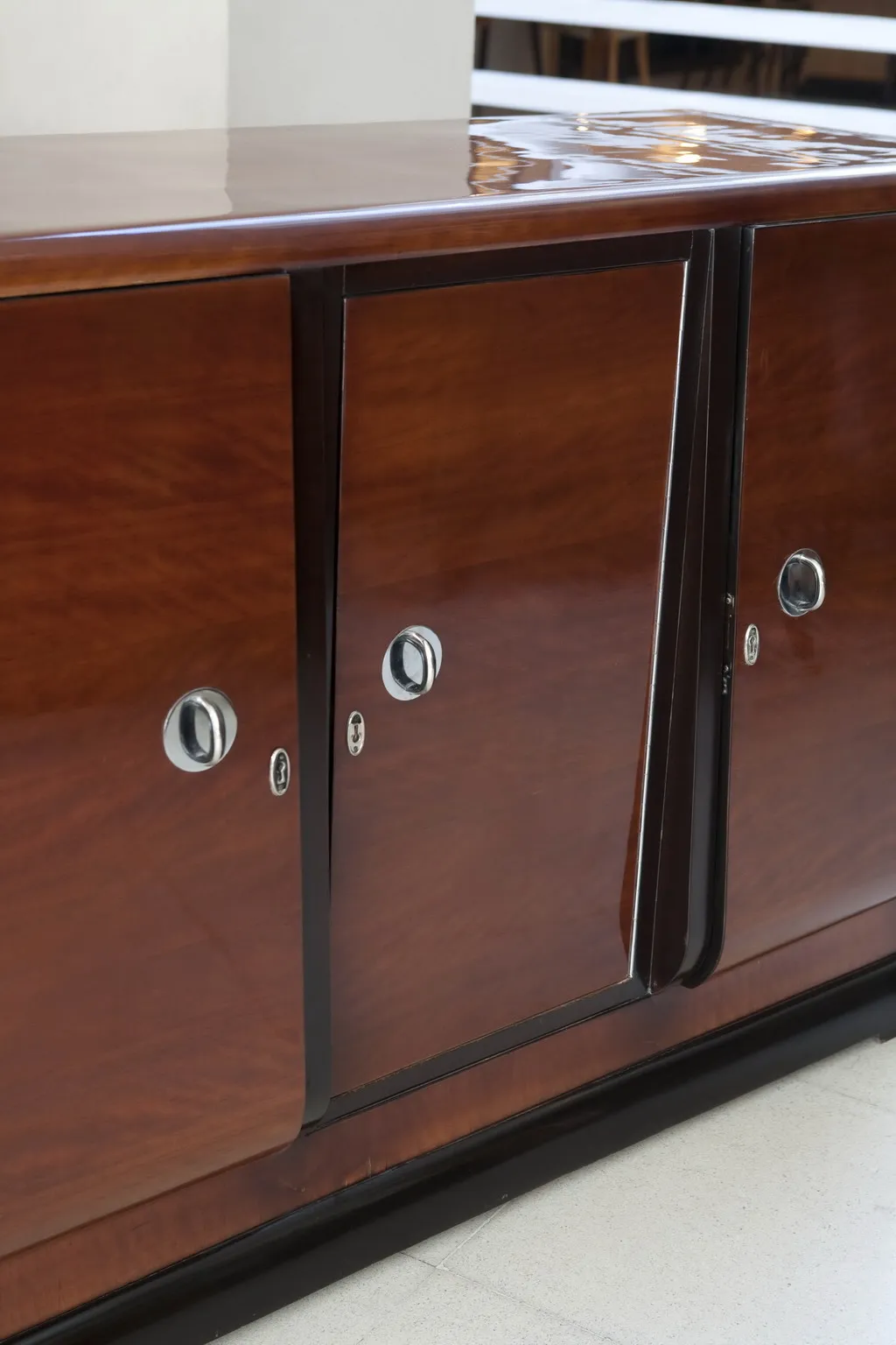 antique sideboard with glossy finishes and cabinets