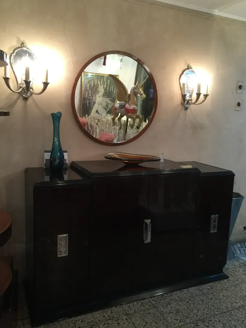 antique sideboard with round mirror