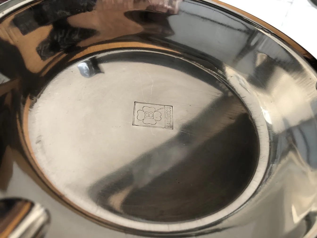 Antique standing ashtray with an elegant design, perfect for a lounge.