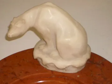 Standing ashtray featuring a bear figure looking down, elegant antique design.