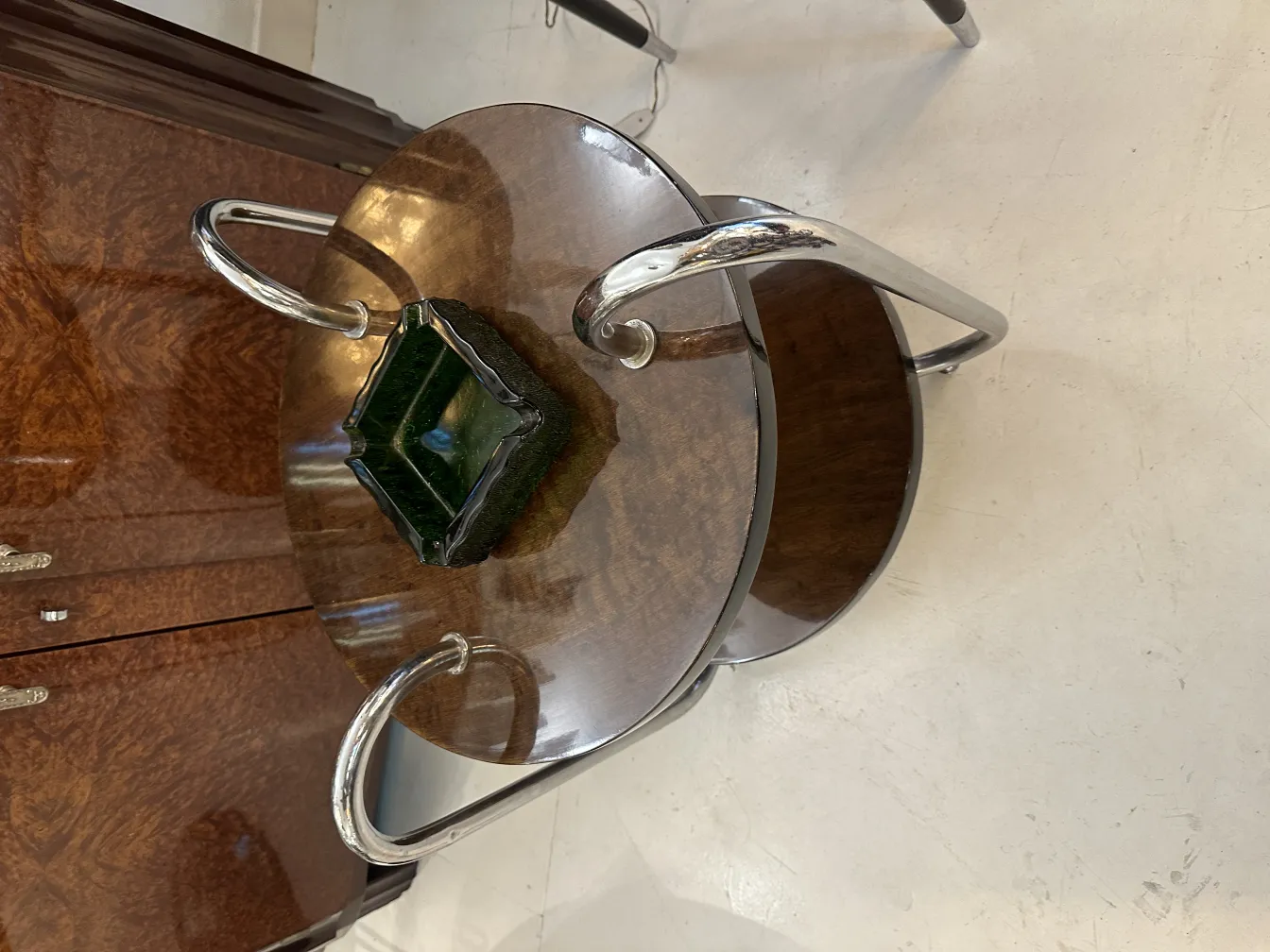 Antique standing ashtray, stylish and elegant design, featuring interesting details in its structure, complemented by a decorative setting