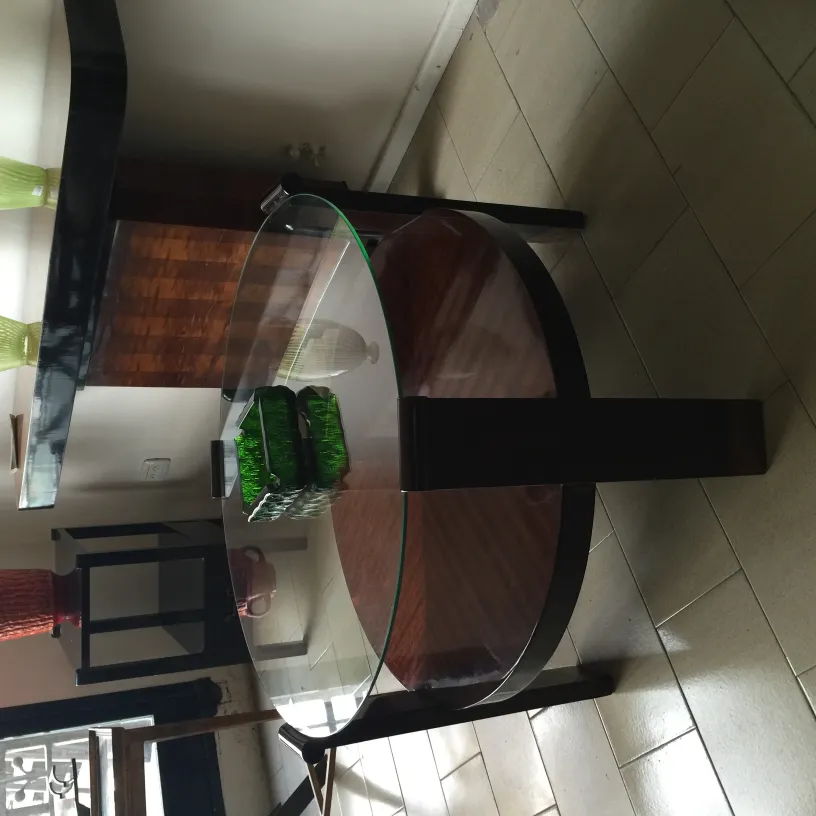 Antique standing ashtray on an elegant table.