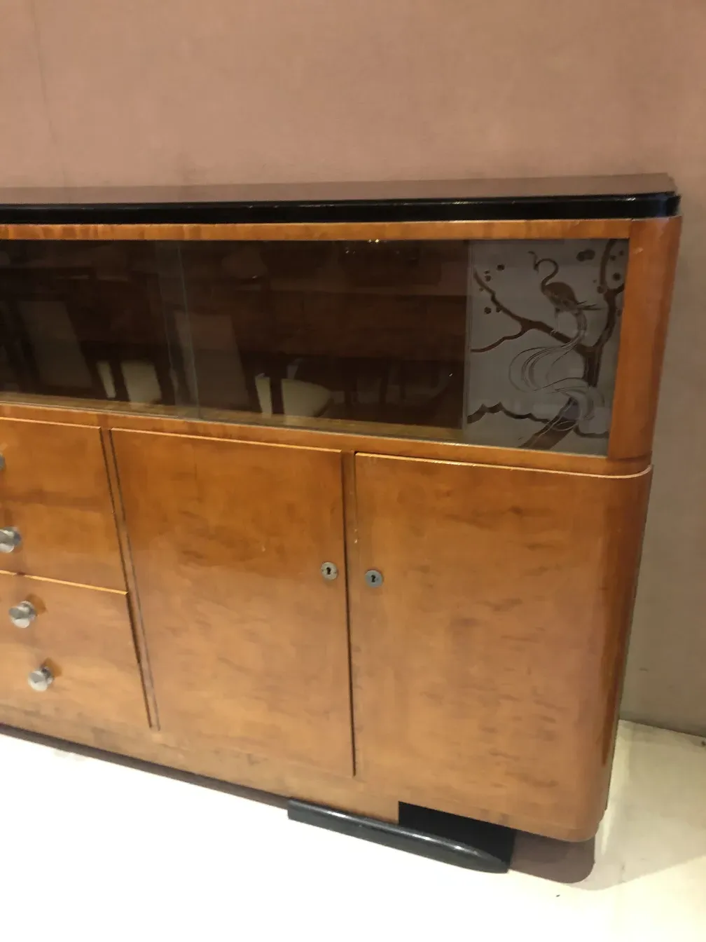 antique bookcase with glass doors and decorative details