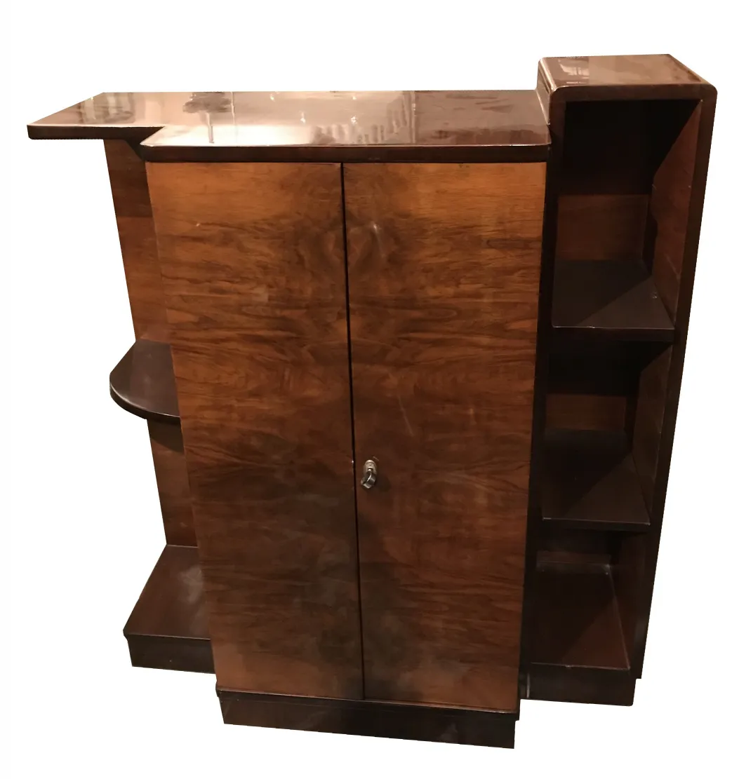 Antique bookcase with two doors and visible shelves, elegant and functional.