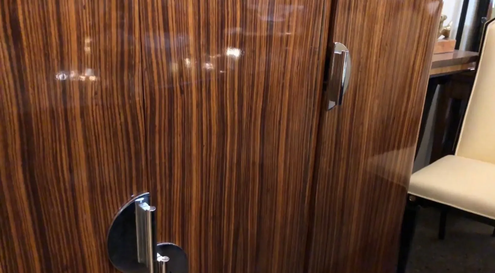 Antique bookcase with polished doors and elegant details.