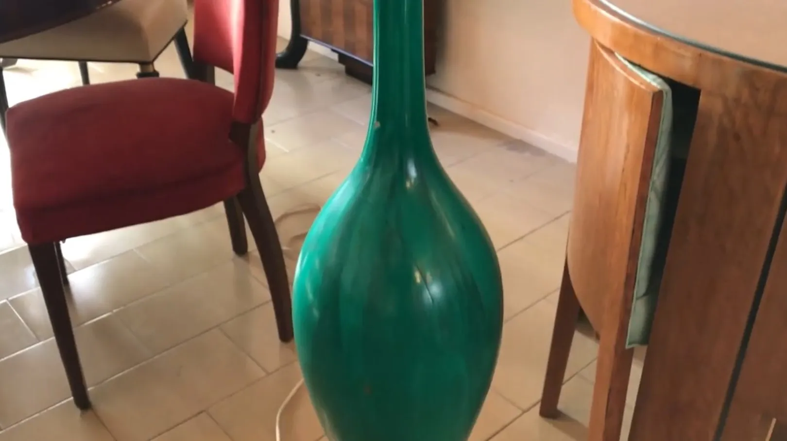 Antique floor lamp by Georg Jansen in bright green color, featuring a streamlined design in a modern setting.