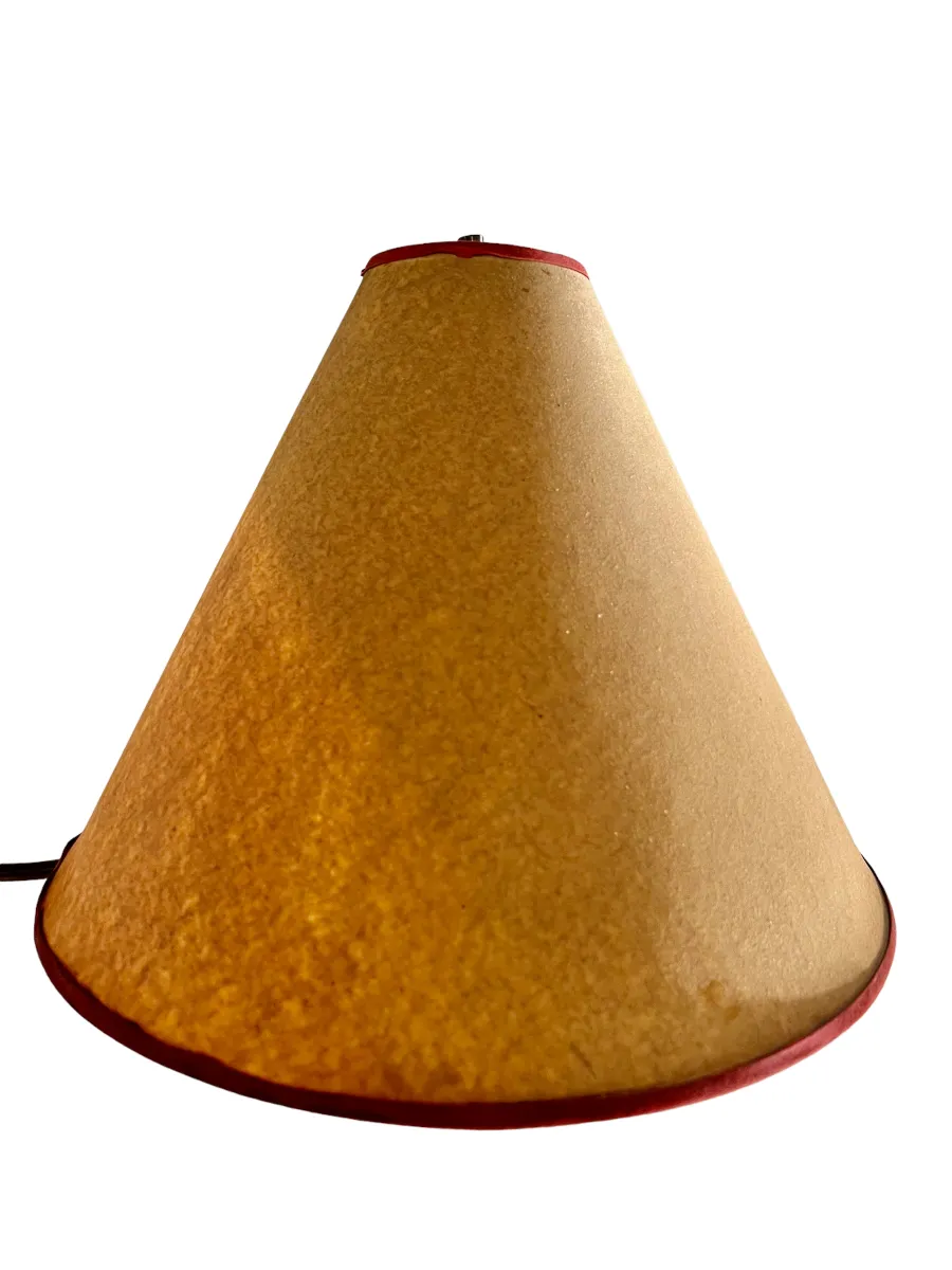 Antique floor lamp with conical shade, light brown color.