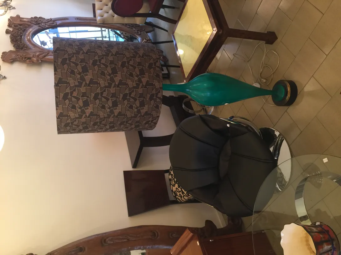 Antique floor lamp Georg Jansen with decorative shade in elegant room, cozy atmosphere.