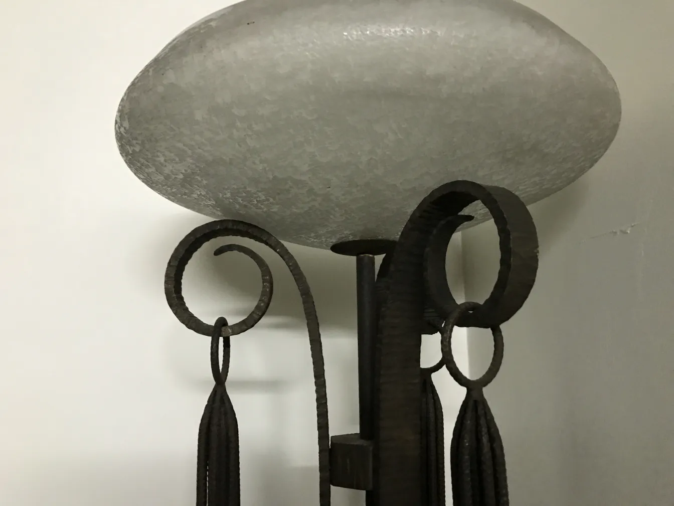 Antique floor lamp with unique design, ornate base and elegant details. Perfect for living rooms.