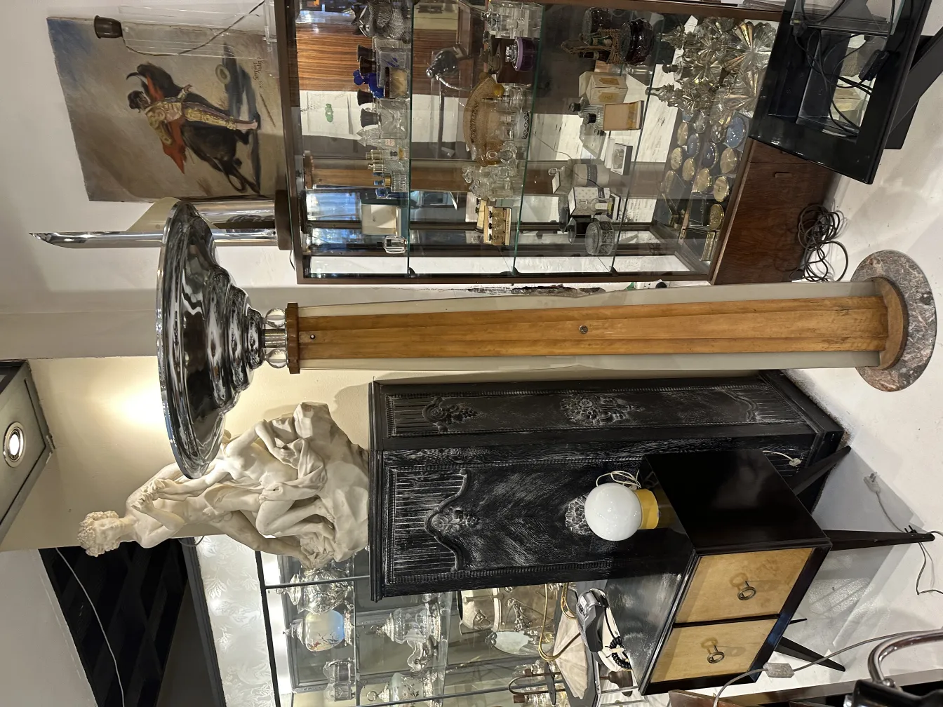 Antique floor lamp with wide shade, elegant setting